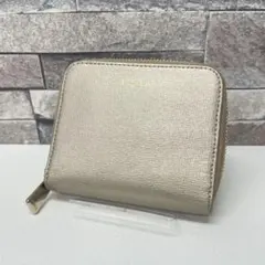 j*n様 FURLA ゴールド 二つ折り財布　保存袋あり