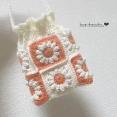 22. 巾着ポーチ　ハンドメイド　編み物　かぎ針編み　花　白　オレンジ　パステル