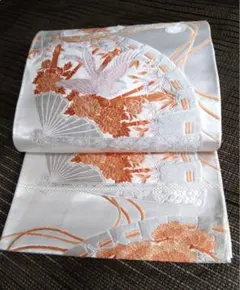 美品 正絹 袋帯 振袖用 白銀色地 橙 鷹鷲扇百花刺繍織文様