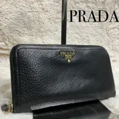✨美品✨プラダ　レザー　ラウンドジップ　ロゴ金具　ゴールドロゴ　ブラック　シボ革