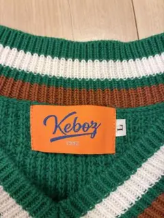 オレンジ ニット ベスト