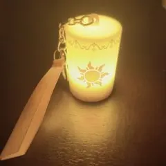 ディズニーキーホルダー　太陽模様のミニランプ