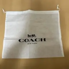 COACH不織布巾着