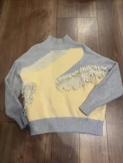 ブージュルード　　フリンジ付きアシンメトリックセーター