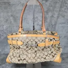 COACH シグネチャー ハンドバッグ タッセル付き - メルカリ