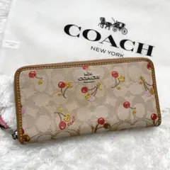 美品✨コーチ　長財布　ラウンド　さくらんぼ　総柄　ラメ　キャンバス　ベージュ
