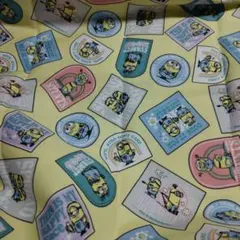 ミニオン プリント生地 淡い黄色 綿