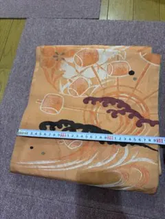 オレンジ色 波と花模様 袋帯