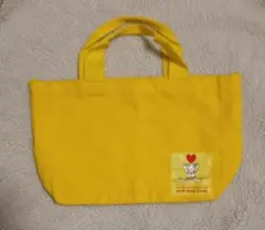 テディベアロゴ付き黄色バッグ