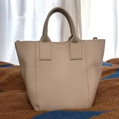 グリーンレーベルリラクシング 白ハンドバッグ ハンモックバッグ(ストライプ付)