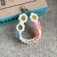 【再販】パラコード　ハンドスマホストラップ　☺︎ニコちゃん☺︎ お花　ハンドメイド