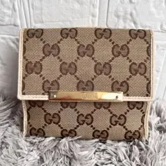 GUCCI GGキャンバス 折り財布　Wホック ホワイト　ロゴプレート