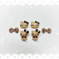 ネイルパーツ 6P 〈J145〉 日焼け ガングロ 黒 ヒョウ柄リボン キティ