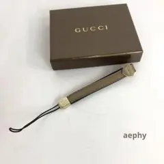 【中古】GUCCI グッチ レザー 携帯ストラップ ゴールド ロゴプレート 箱付のサムネイル