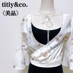 【美品】ティティーアンドコー ボタニカル五分袖フレア　サイドボタンラップトップのサムネイル