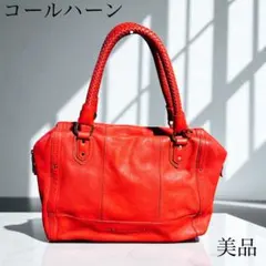 美品級コールハーンCOLE HAAN レザーバッグタッセル付き編み込みハンドル