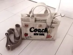 コーチカーゴトート26 スヌーピーピーナッツコラボ - メルカリ