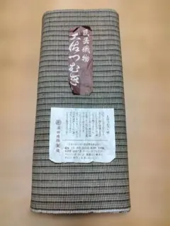 着尺反物　綿（土佐つむぎ）　黒、黄土、水色、白の織りの格子柄のサムネイル