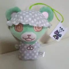 緑色のクマ ぬいぐるみ おしゃべやフリル付きの帽子と水玉模様