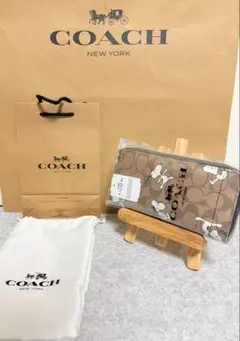 正規品COACH ブラウンシグネチャースヌーピーコラボ長財布