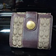 COACHコーチ　二つ折り財布　シグネチャー柄　パープル