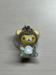 リラックマ めじるしアクセサリー きょうりゅう着ぐるみ　チャイロコグマ