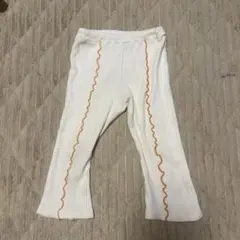 ホワイトパンツ（オレンジの波型）