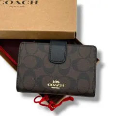 【未使用級】COACH　コーチ　二つ折り財布　ブラウン　PVC レザー　シグネ