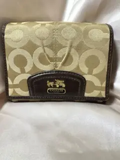 【人気】コーチ 二つ折り財布 シグネチャー キャンバス ブラウン 馬車ロゴ金具付