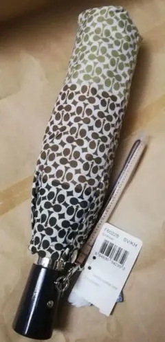 COACH 折りたたみ傘 ミニシグネチャー柄 グラデーション 茶系 コーチのサムネイル