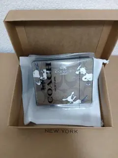 新品・未使用 COACH 二つ折り財布 スヌーピー