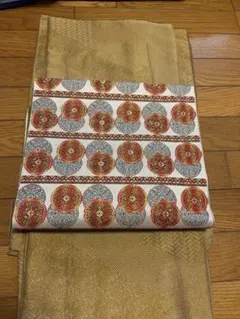 名古屋帯 豪華な正倉院文様 花丸文 主役級の帯 金 オレンジ系 単 全通柄