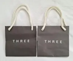 【未使用】THREE♡ショップ紙袋　2枚　ショッパー　ブランド紙袋のサムネイル
