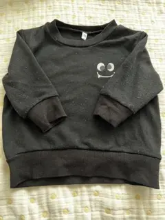 黒い顔プリントのトレーナー 80cm