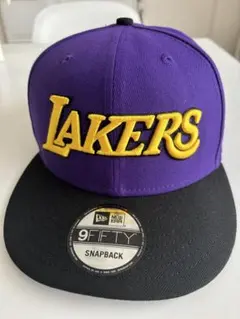 レイカーズニューエラキャップ