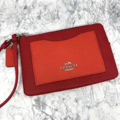 COACH レザー ストラップ付きポーチ レッド×オレンジ