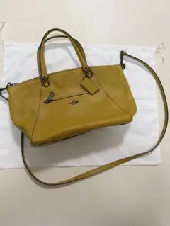 COACH コーチ レザー ハンドバッグ イエロー タッセル チャーム付 