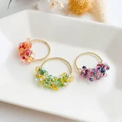 ガラスビーズのリング*・ハンドメイド 指輪✳︎オレンジ・イエローグリーン・パープル