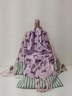 ハンドメイド 巾着袋 ナップサック 式　紫に黒リボン柄 ストライプ 2点セット