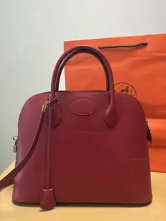 レッド エンボス加工ハンドバッグ エルメス - メルカリ