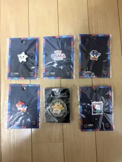大阪関西万博ATC PAVILION ピンバッジ こみゃく ATCパビリオン - メルカリ