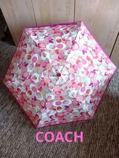 新品未使用✨️COACH折りたたみ傘✤ピンク系シグネチャー柄✤のサムネイル