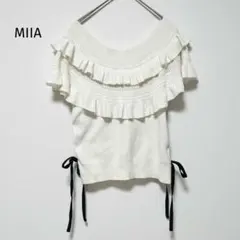 ミーア MIIA ニット 半袖 オフショルダー フリル 白系 リボン 綿混のサムネイル
