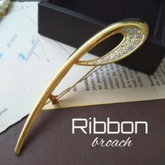 流線型 ゴールドリボンブローチ キラキラ 冠婚葬祭 結婚式 モダン メタリック