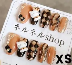931:キティちゃんヒョウ柄格子柄にラメニュアンスリボンネイルチップ☆XSサイズ