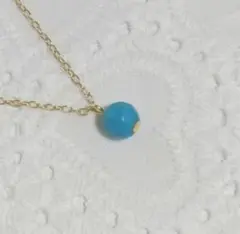 ターコイズブルーのネックレス　ゴールド　ラウンドカット　練り　ペンダント