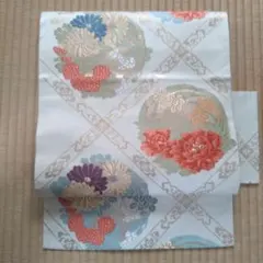 白地に紫と青.オレンジ.金銀の花柄刺繍(菊と牡丹等) 正絹袋帯風名古屋帯
