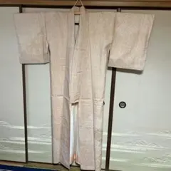 淡いオレンジ色　幾何学模様 結城紬