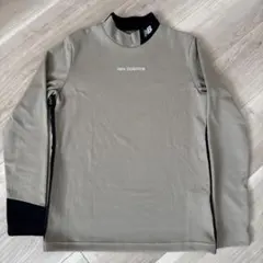 new balance ベージュ ハイネックシャツのサムネイル
