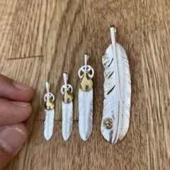 コンビ ハート ホイール フェザー M ネックレス ハンドメイド - メルカリ
